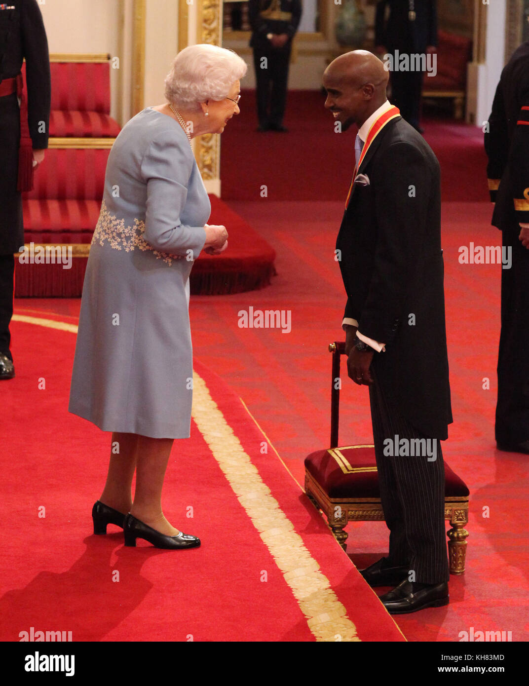 Sir Mohammed Farah from London is made a Knight Bachelor of the British Empire by Queen Elizabeth II at Buckingham Palace, London. Stock Photo