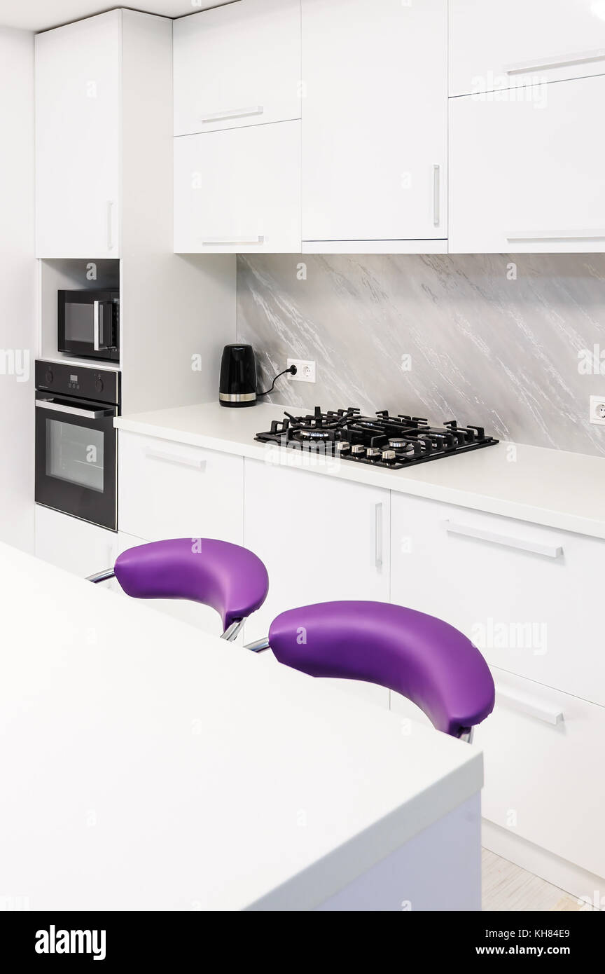 white dining table in modern kitchen Stock Photo - Alamy