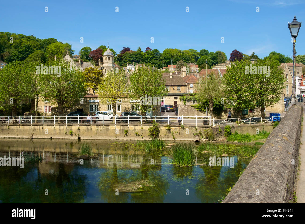 Historic buildings on the hillside by the River Avon in spring sunshine, Bradford on Avon, Wiltshire, UK Stock Photo