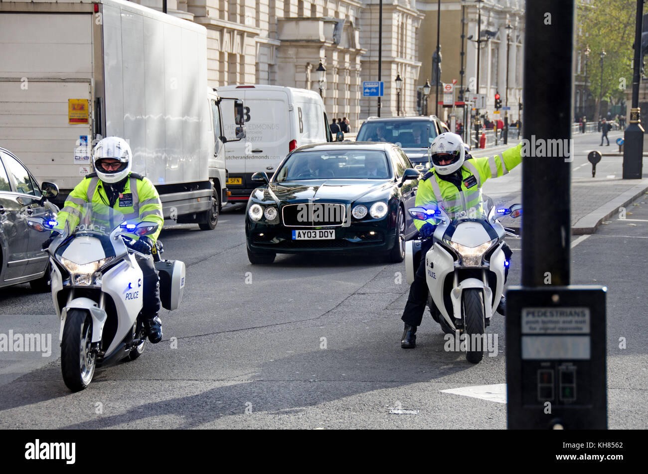 London, England, UK. Police motorcyclists stop the traffic in Whitehall for the Prime Minister's car Stock Photo