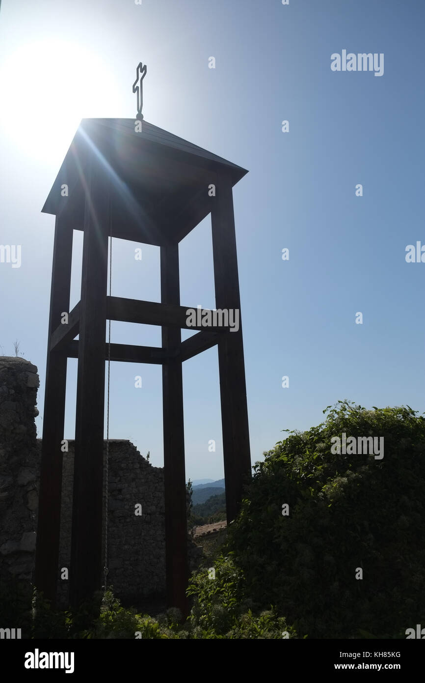 Gallows church bell waving on a sunny windy day. Summer time. Pietrasecca AQ is part of the Cammino dei Briganti trekking, The Walk of the Brigands. I Stock Photo
