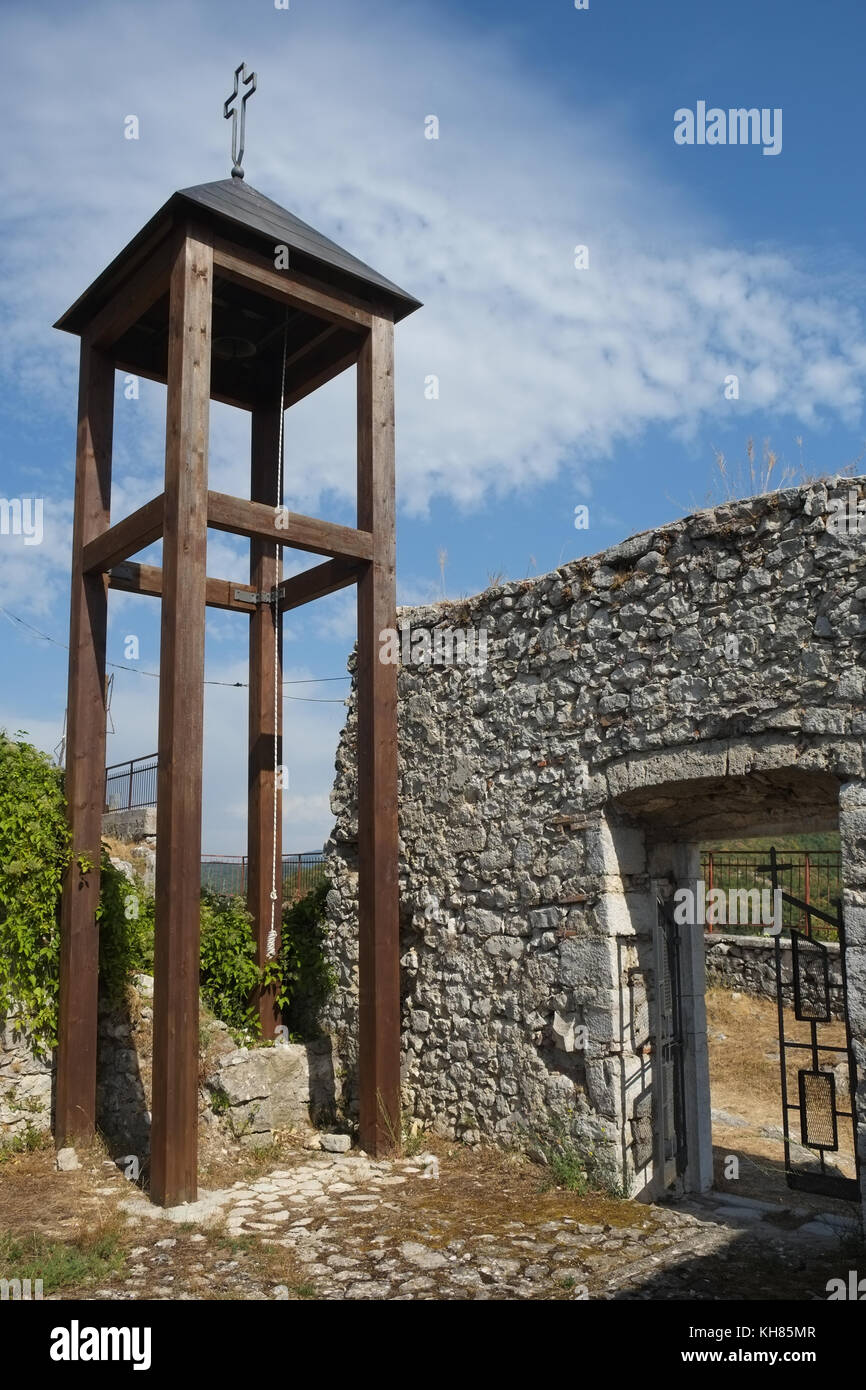 Gallows church bell waving on a sunny windy day. Summer time. Pietrasecca AQ is part of the Cammino dei Briganti trekking, The Walk of the Brigands. I Stock Photo