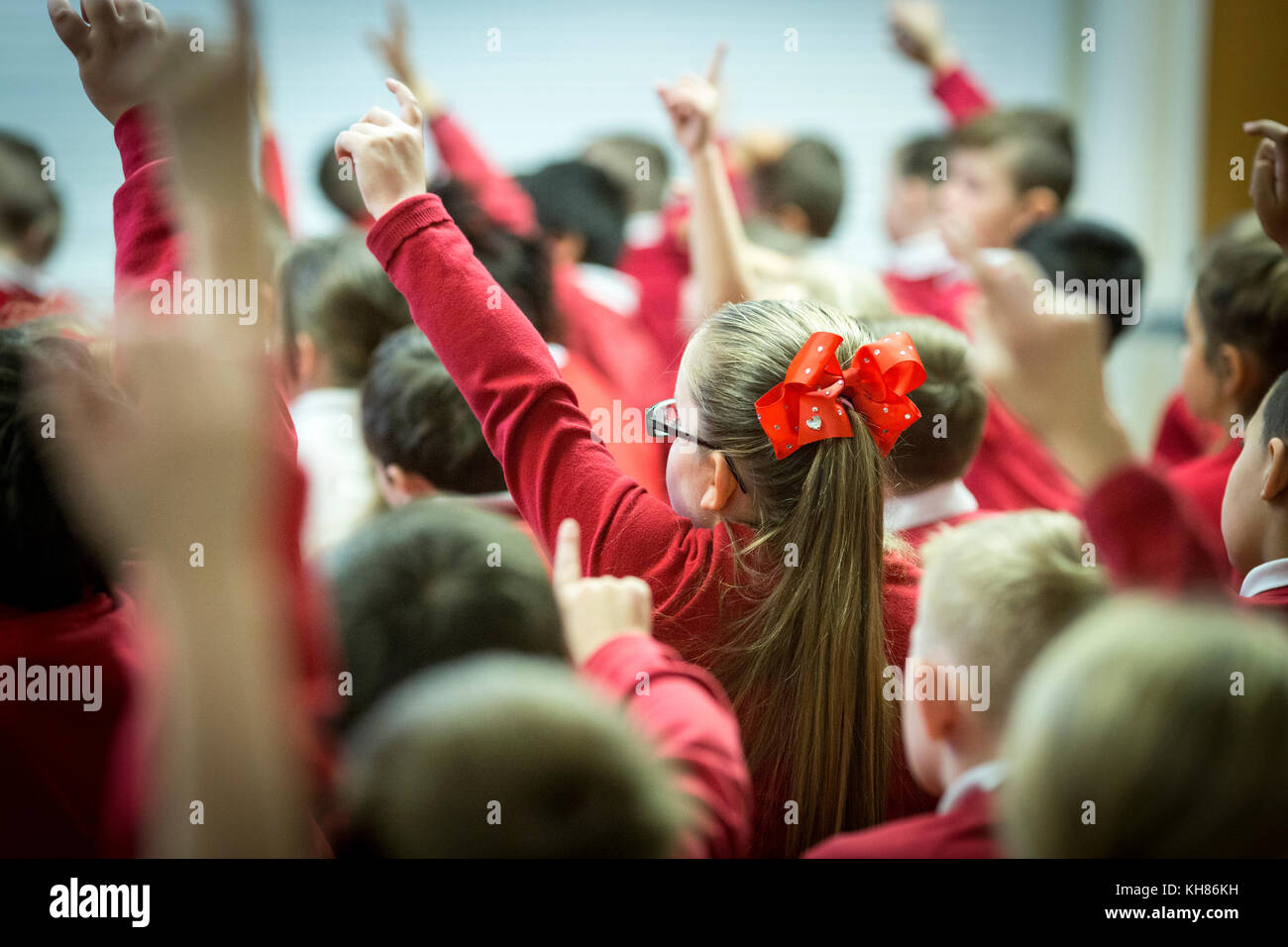 unidentifiable children in a primary school assembly Stock Photo