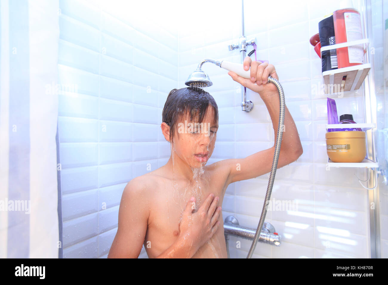 France Young Boy In The Bathroom Taking Shower Stoc