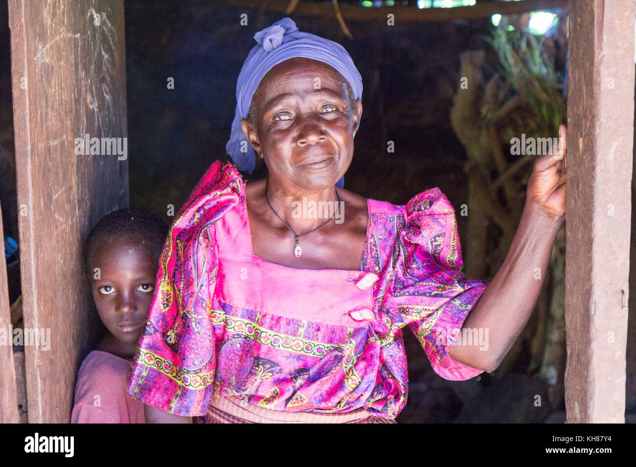 An old Ugandan woman in a traditional Ugandan costume ('Gomesi' or 'Busuuti') characteristic for the tribes of Busoga and Buganda. Stock Photo