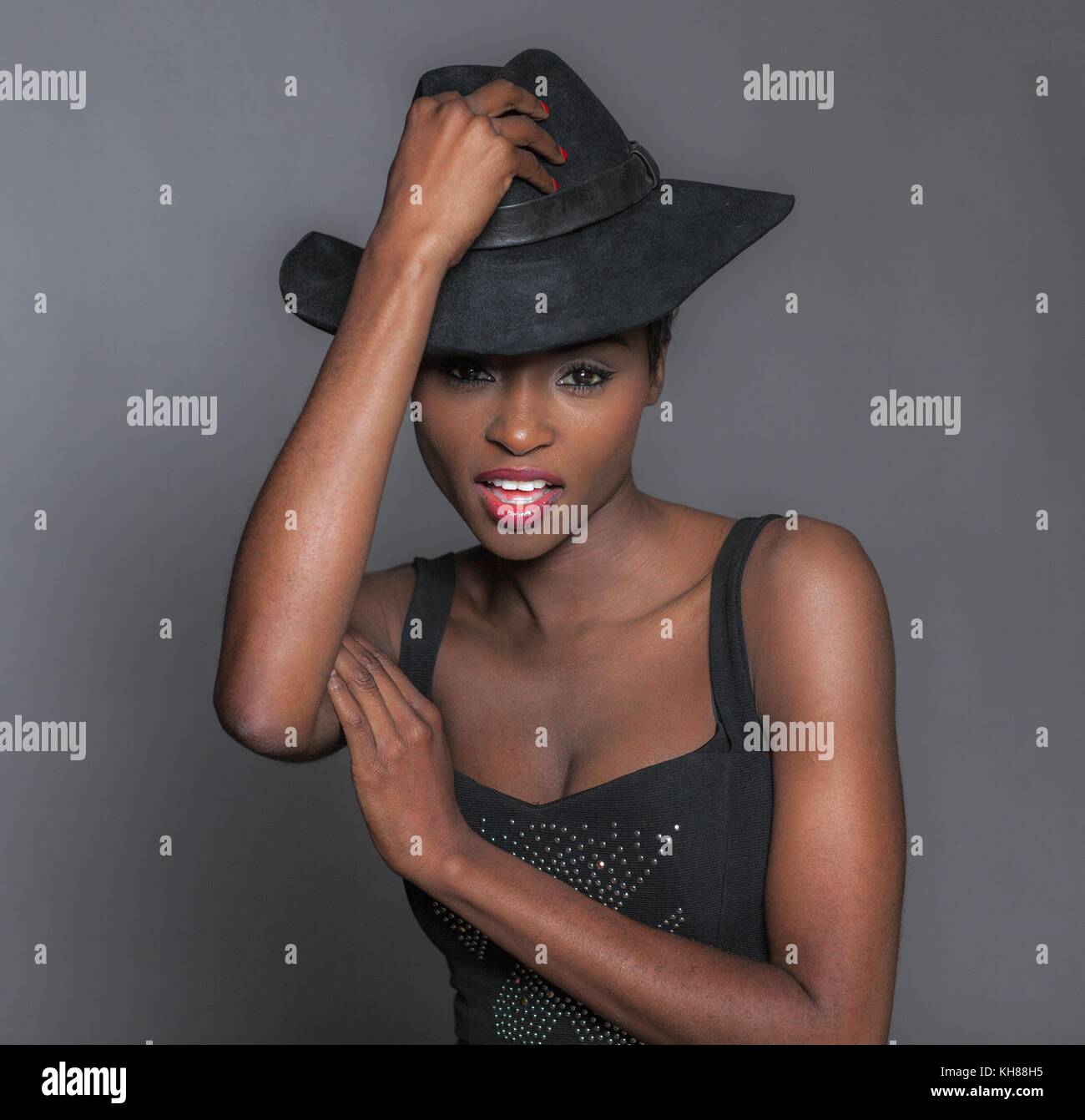 Close up of a young attractive African women with hat Stock Photo - Alamy