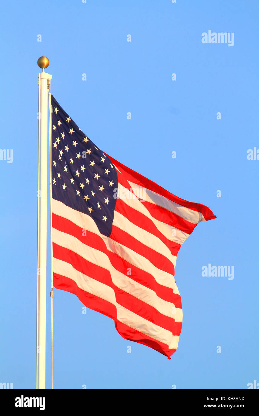 US flag in blue sky Stock Photo Alamy