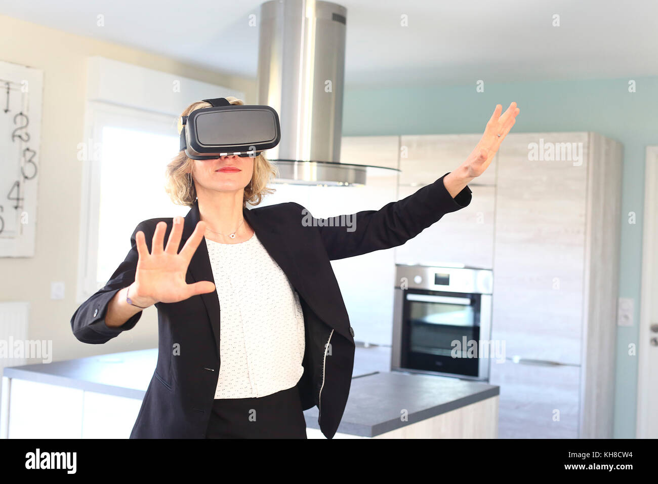 Young woman at home using virtual mask Stock Photo - Alamy