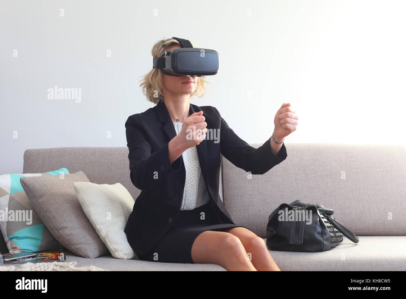 Young woman at home using virtual mask Stock Photo - Alamy