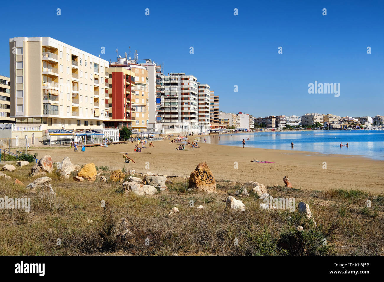 Torrevieja, Spain - October 20, 2017: Acequion beach in the Torrevieja resort city. Torrevieja is a Mediterranean city, popular travel destination for Stock Photo