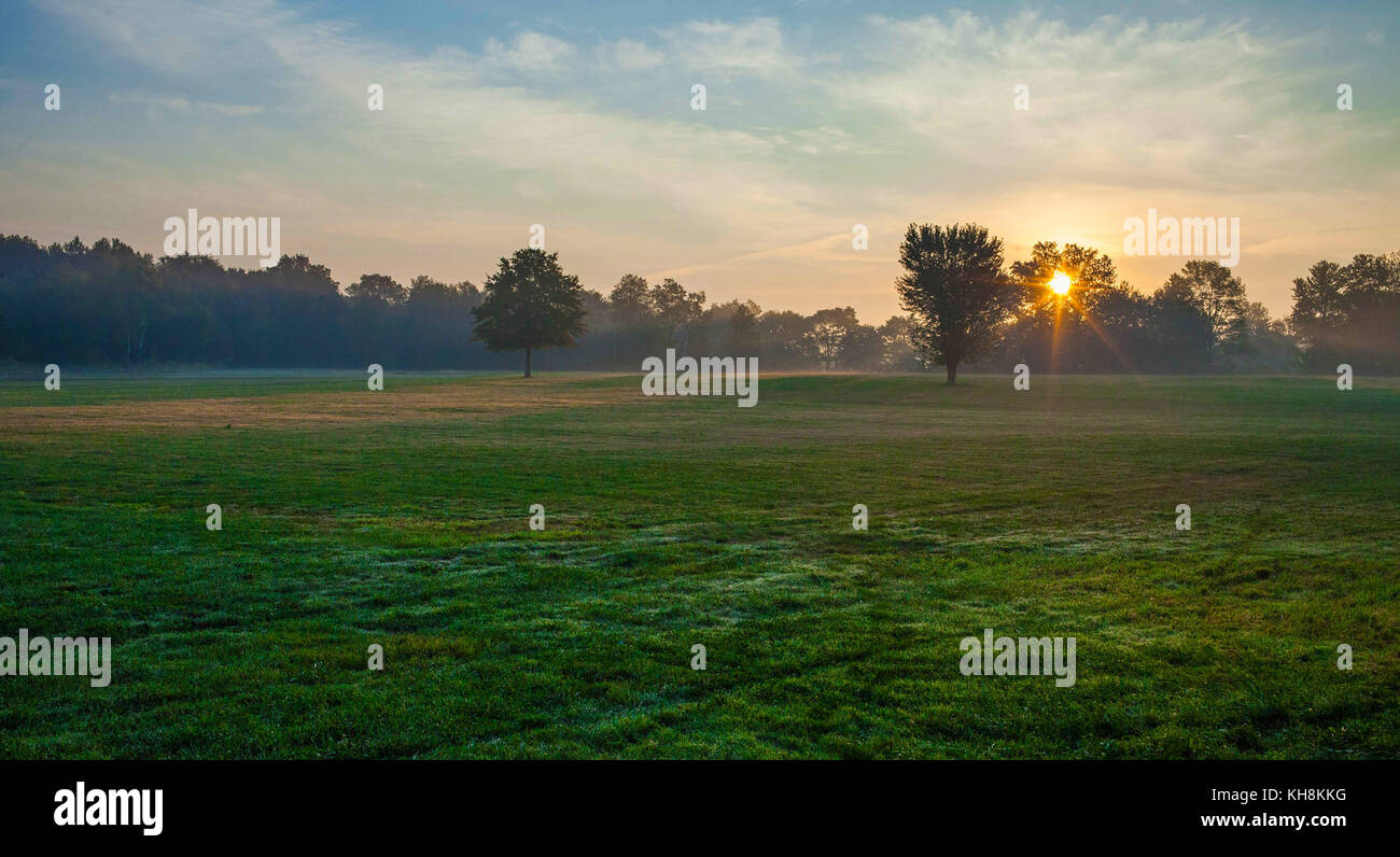 Sunrise in the field Stock Photo - Alamy