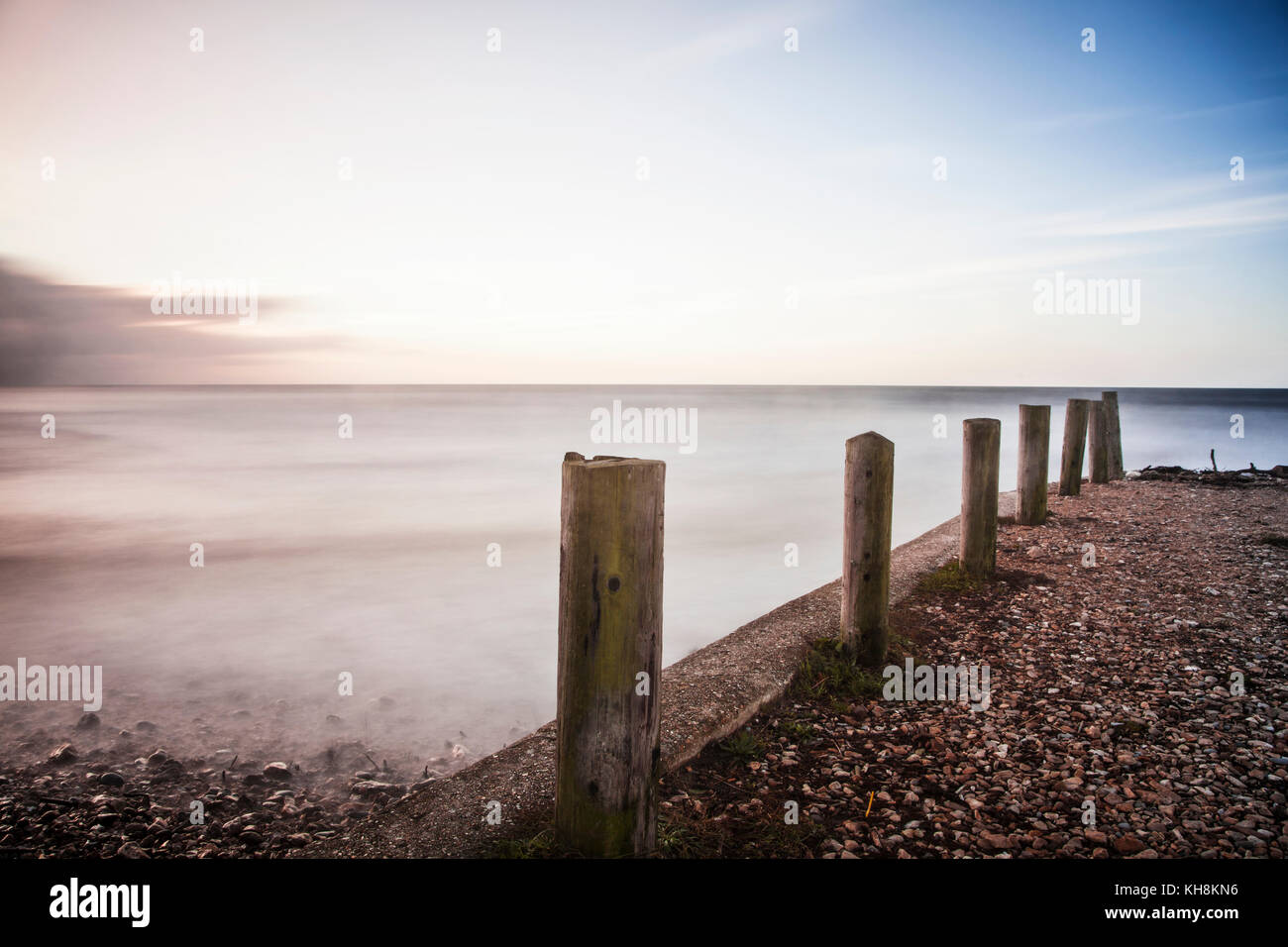 A simple image of groynes on the beach at Charmouth in Dorset. Stock Photo