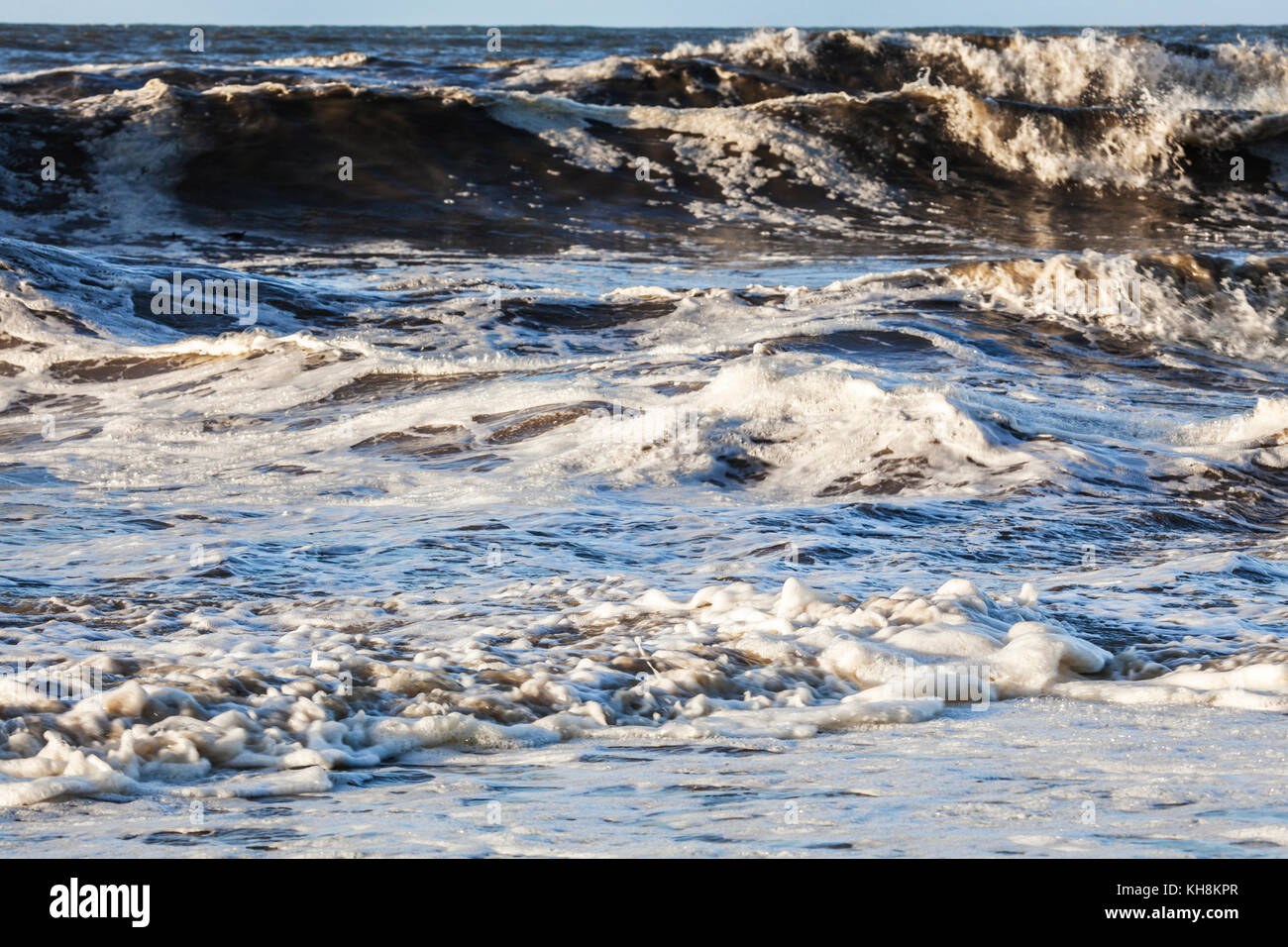 Waves crashing against the shore. Stock Photo