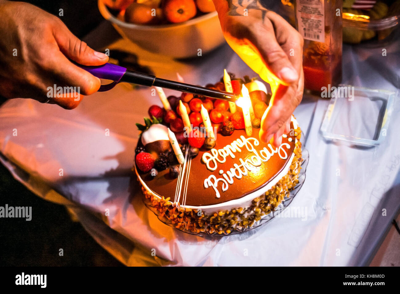 birthday cake with candles lit Stock Photo - Alamy