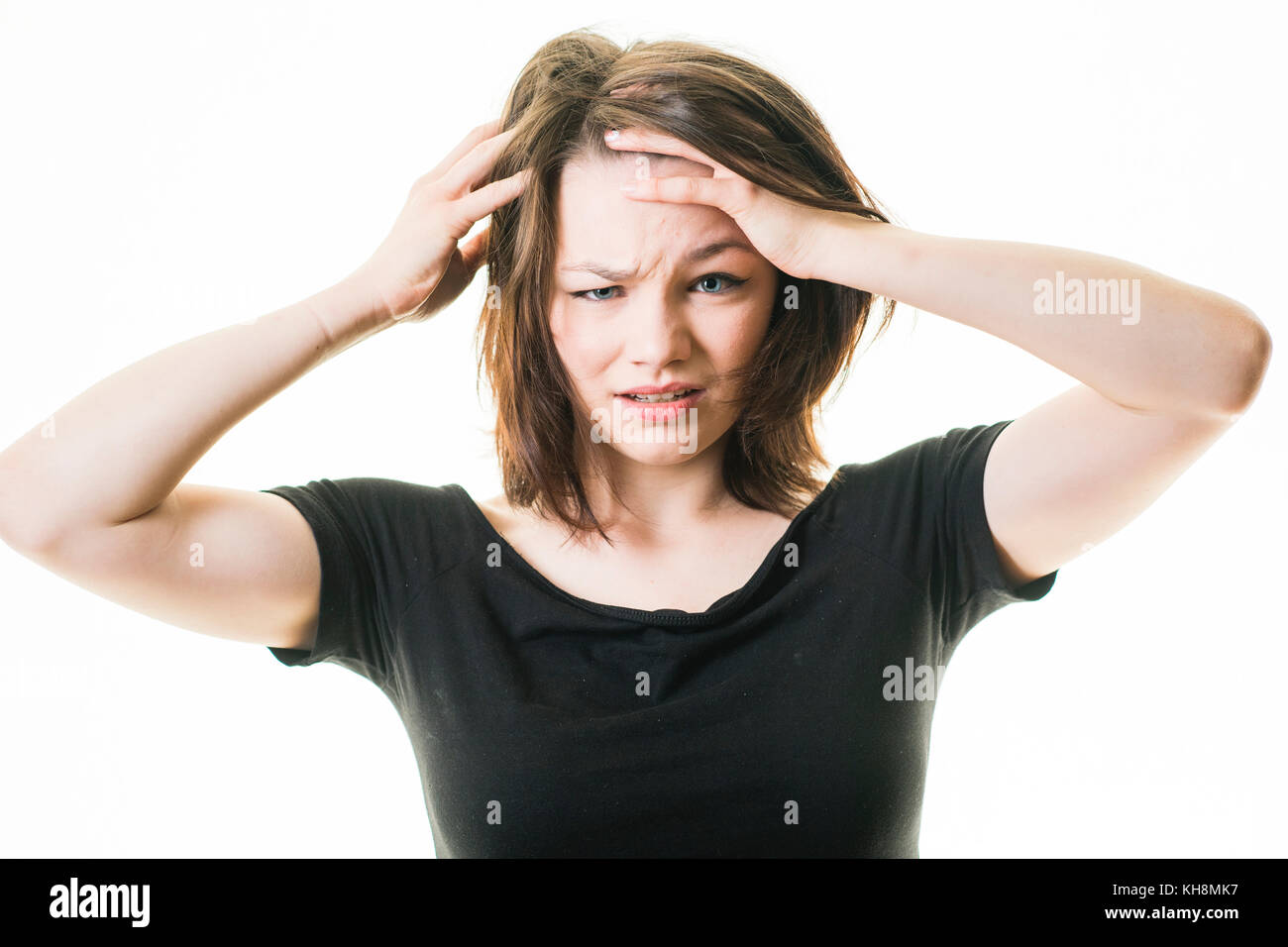 A young brown haired  caucasian teenage girl looking and feeling ill sick hungover bad,  UK Stock Photo