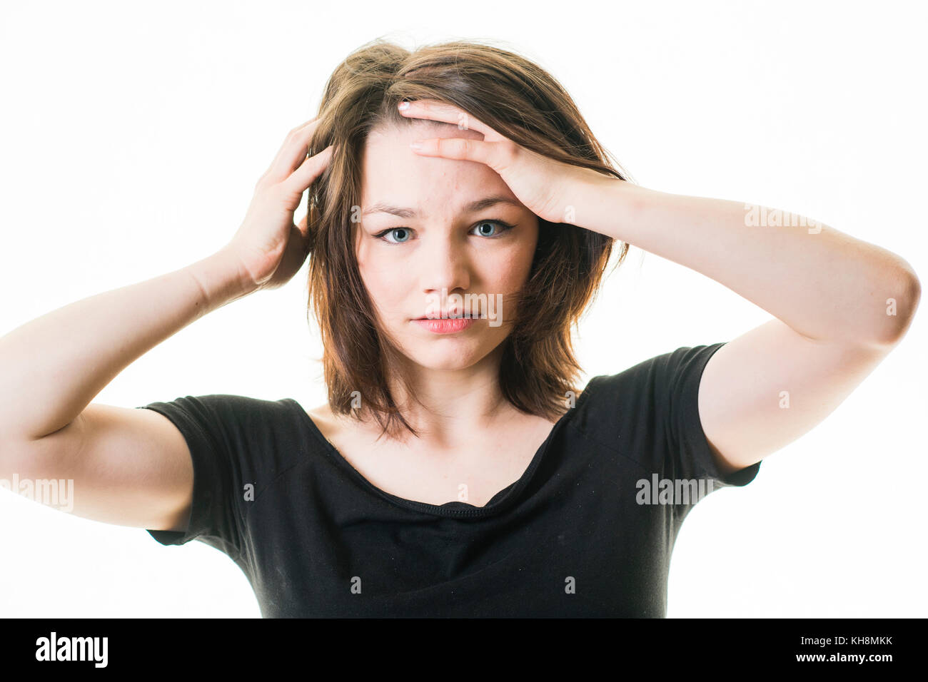 A young brown haired  caucasian teenage girl looking and feeling ill sick hungover bad,  UK Stock Photo