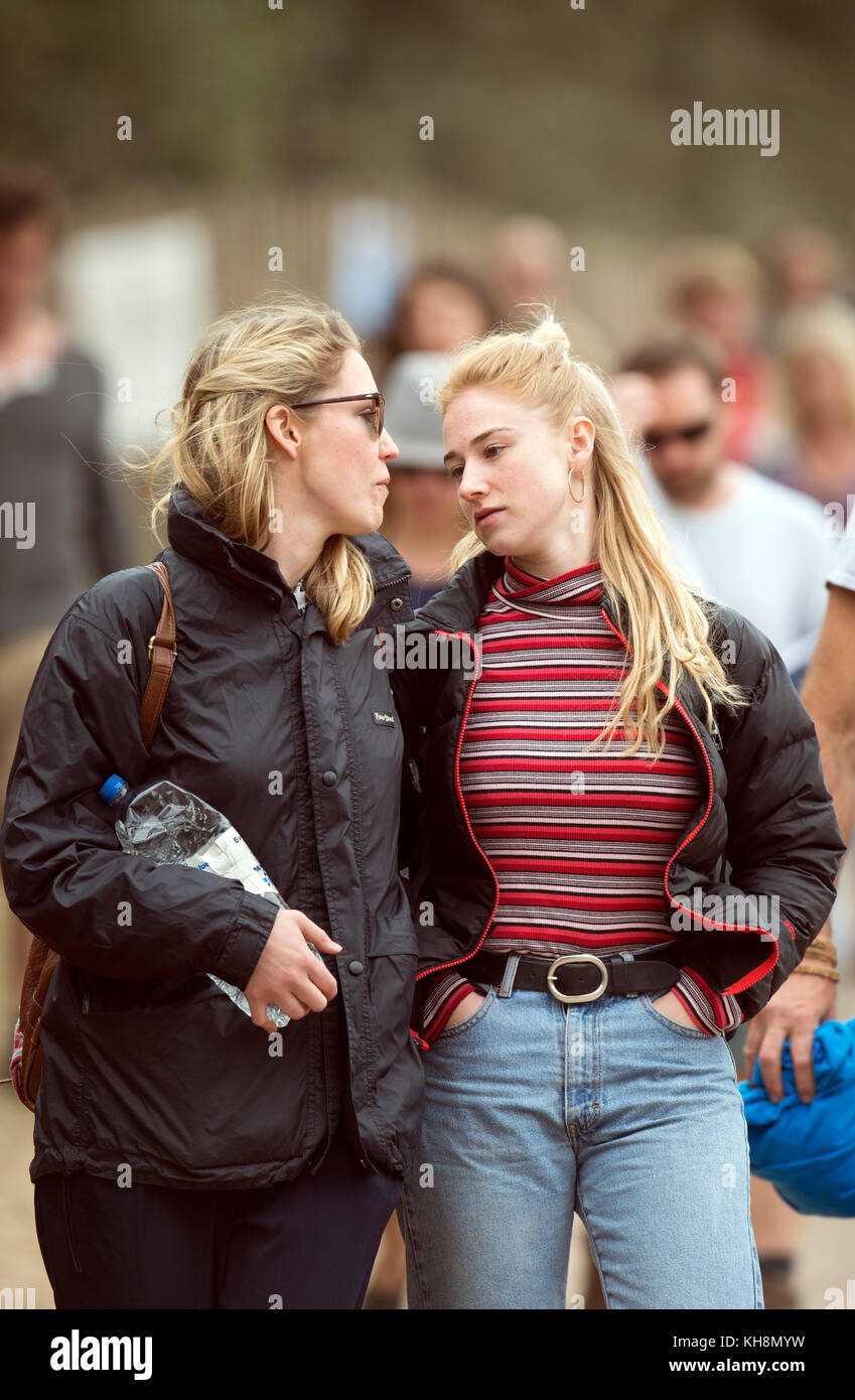 Two female friends at Glastonbury Festival 2017 Stock Photo