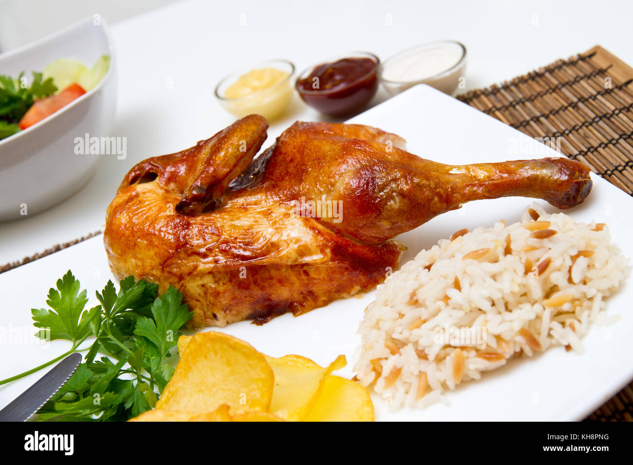 Charcoal baked chicken and side dishes Stock Photo