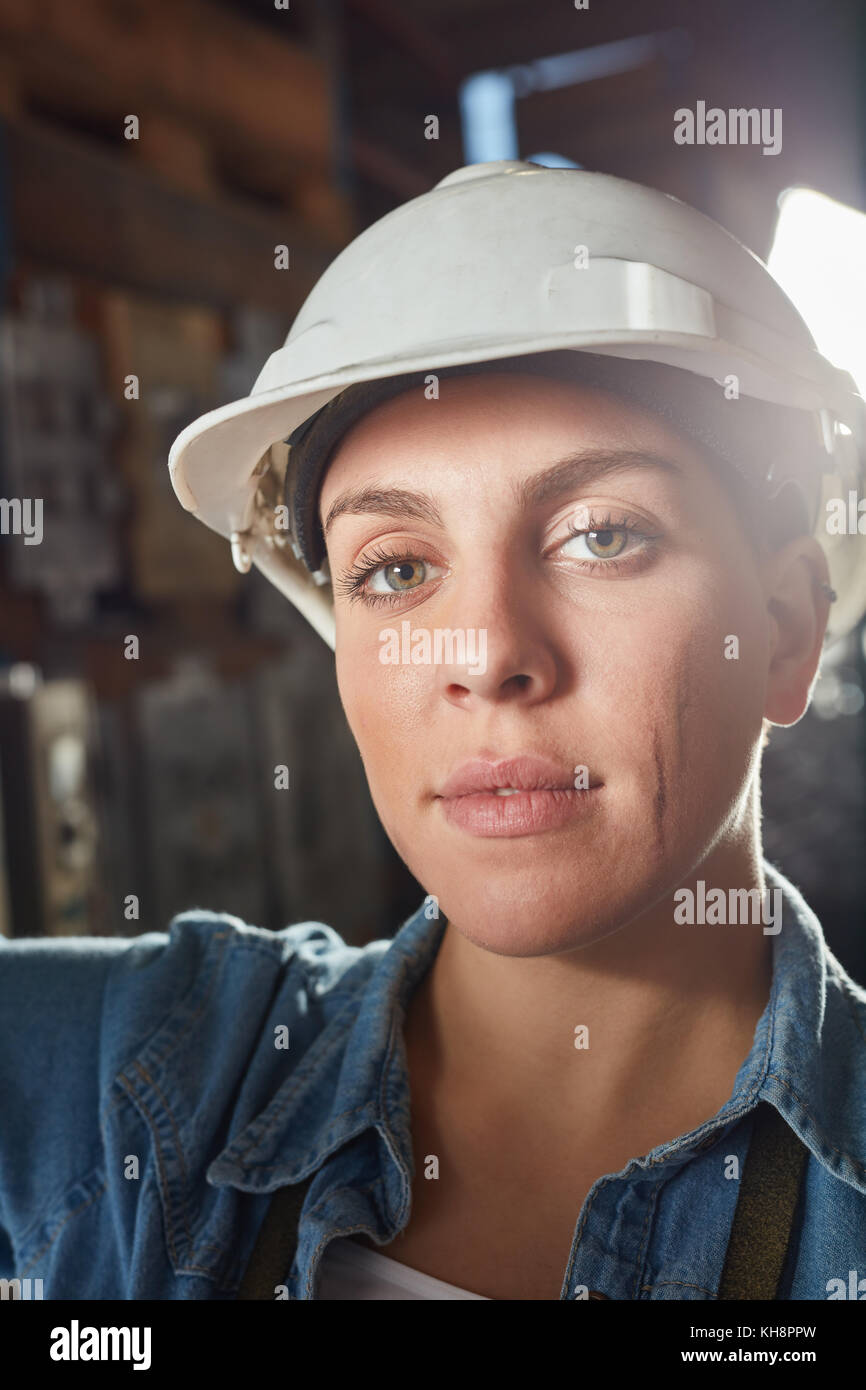 Woman as metalworker apprentice in metallurgy factory Stock Photo