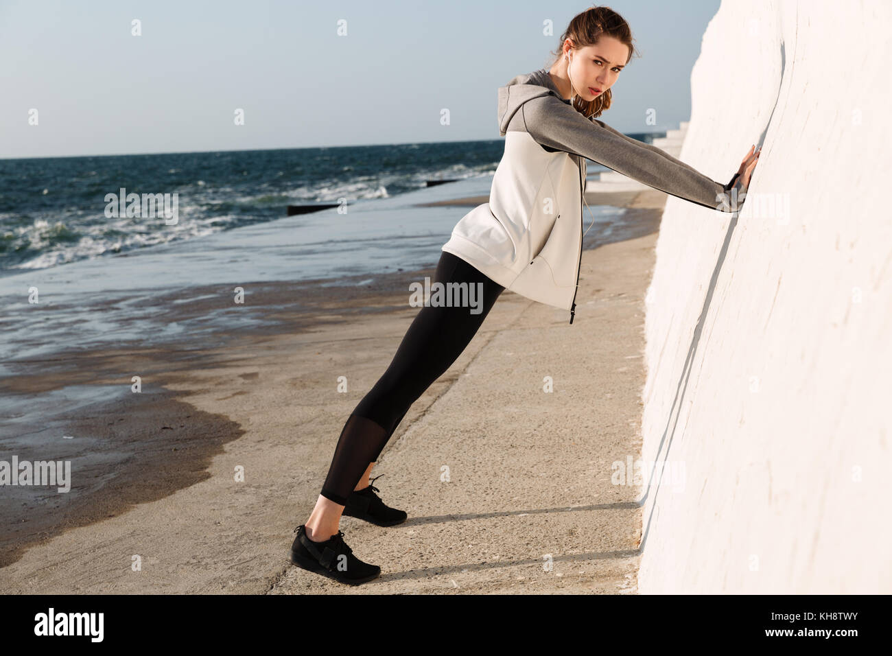 Fulllength photo of charming fitness woman doing pushups while