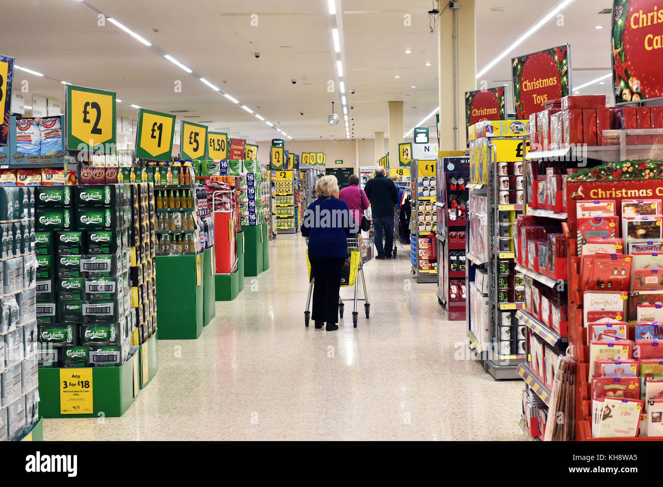 Large Aisle of a supermarket at Christmas with special offers on the end aisles. Stock Photo