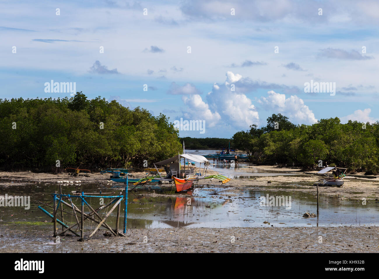 Asia, Philippines, Cebu, Mactan, Mactan Shrine, Banca or pump boats in the mangroves at low tode Stock Photo
