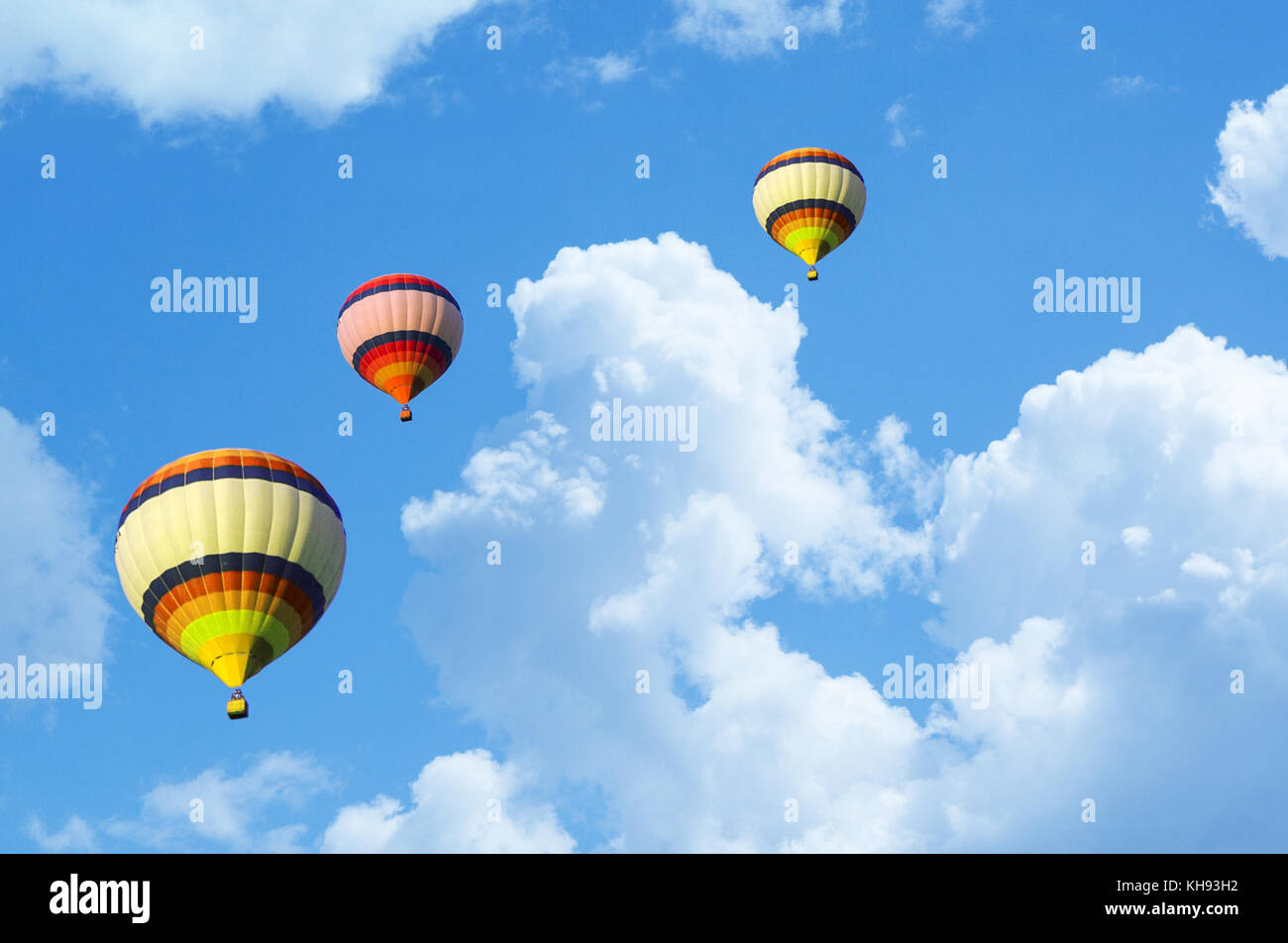 Hot air balloon flying in a blue sky Stock Photo - Alamy