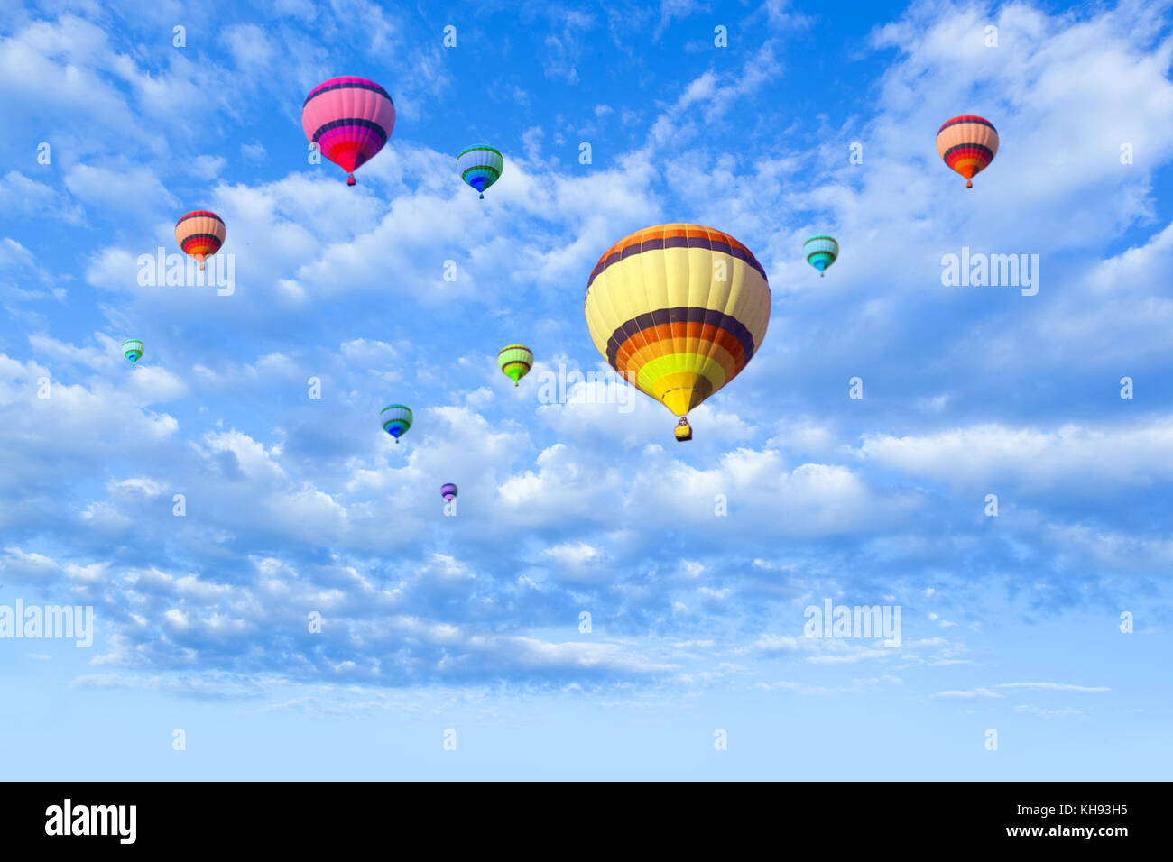 Hot air balloon flying in a blue sky Stock Photo - Alamy