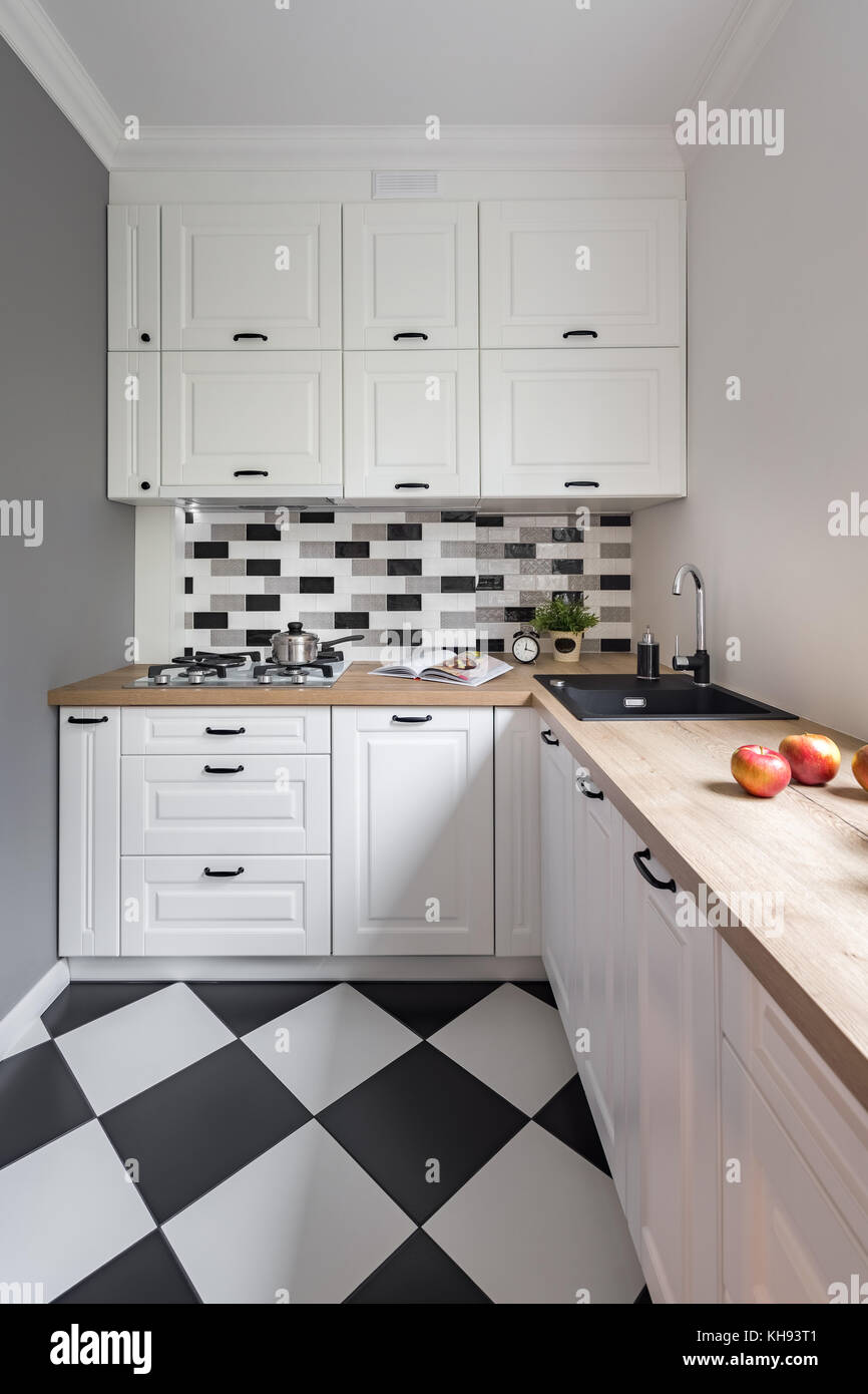 Modern white Kitchen Counter and Kitchen Equipment in Luxurious Apartment.  small kitchen counter ideas in the residential Stock Photo - Alamy