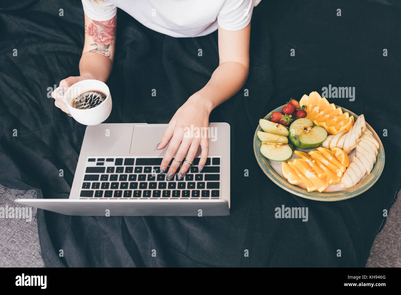 woman with laptop on bed Stock Photo - Alamy