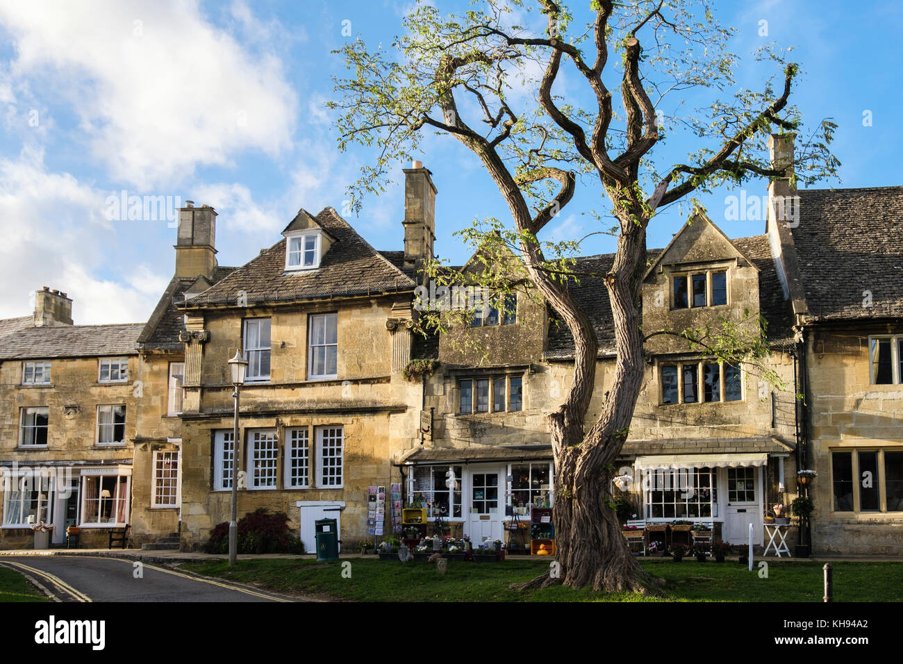 Cotswold stone buildings and shops in historic Cotswolds AONB village