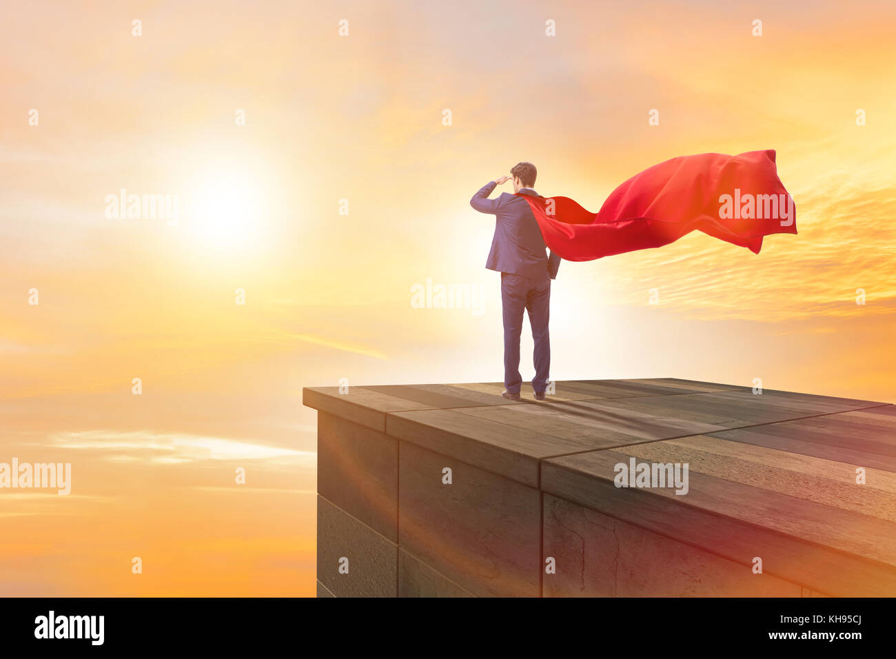 Super hero businessman on top of building ready for challenge Stock ...