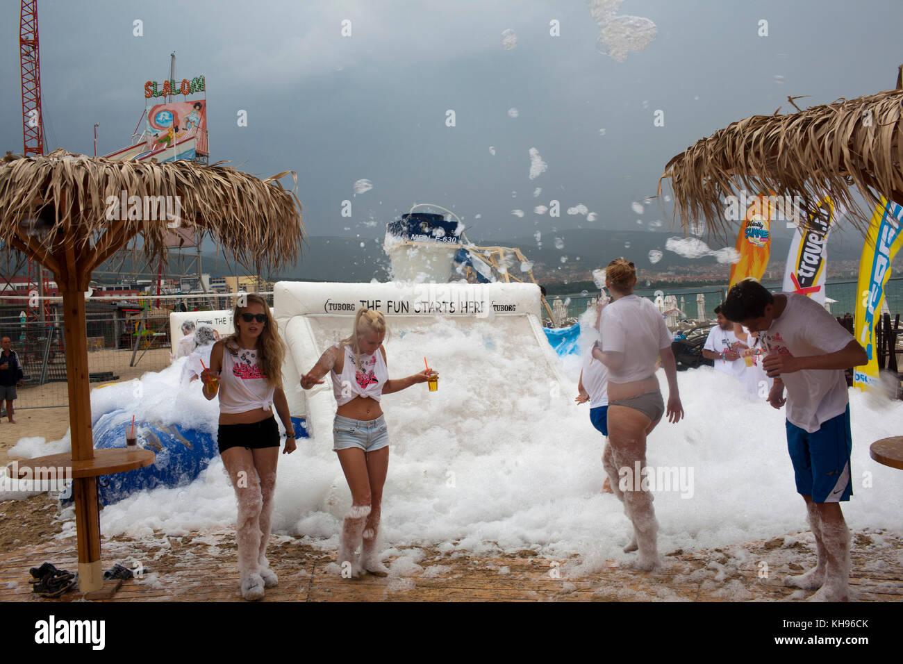 Young German tourists at a foam party hosted at Guaba Beach Bar on Sunny Beach, Bulgaria.  Sunny Beach is a major seaside resort on the Black Sea coas Stock Photo