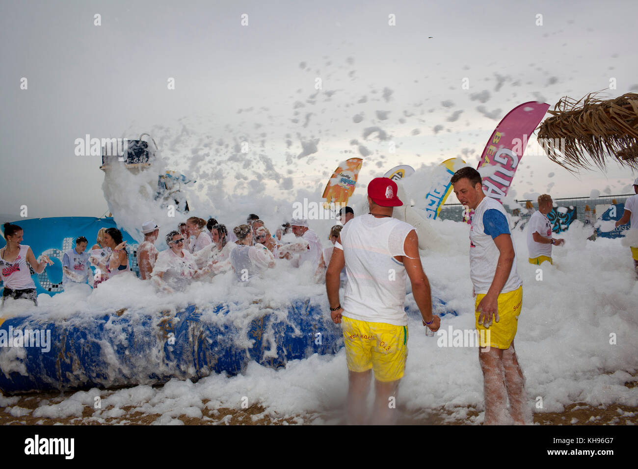 Young German tourists at a foam party hosted at Guaba Beach Bar on Sunny Beach, Bulgaria.  Sunny Beach is a major seaside resort on the Black Sea coas Stock Photo