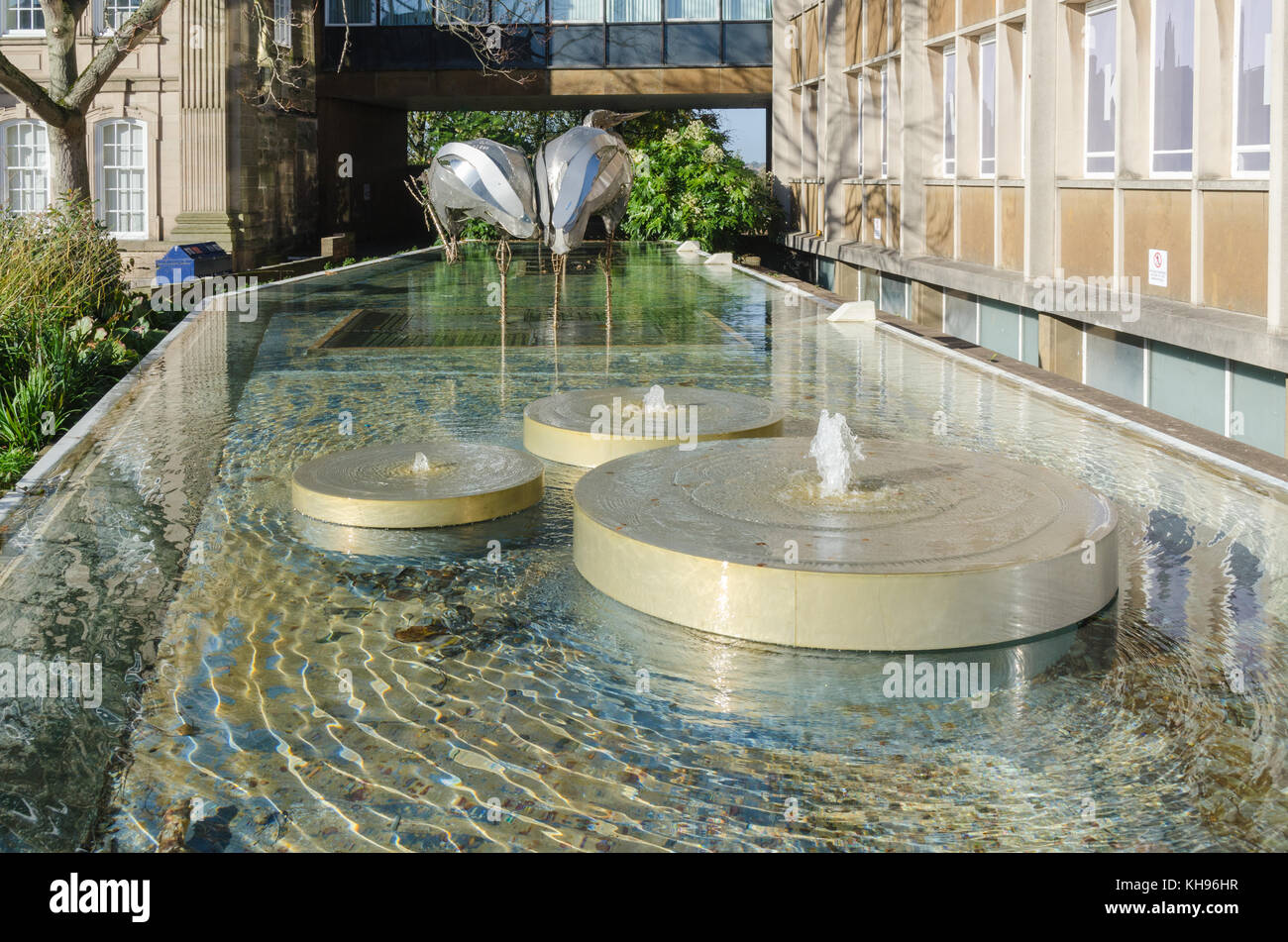 Heron sculpture in water feature outside Shire Hall in Warwick, Warwickshire, UK Stock Photo