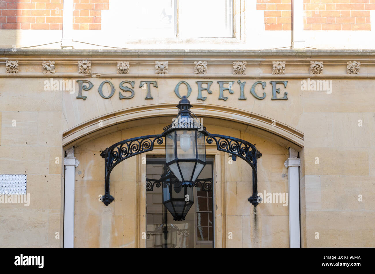 Old post office building in Old Square, Warwick, Warwickshire, UK with Post Office sign above entrance and large black steel lantern Stock Photo