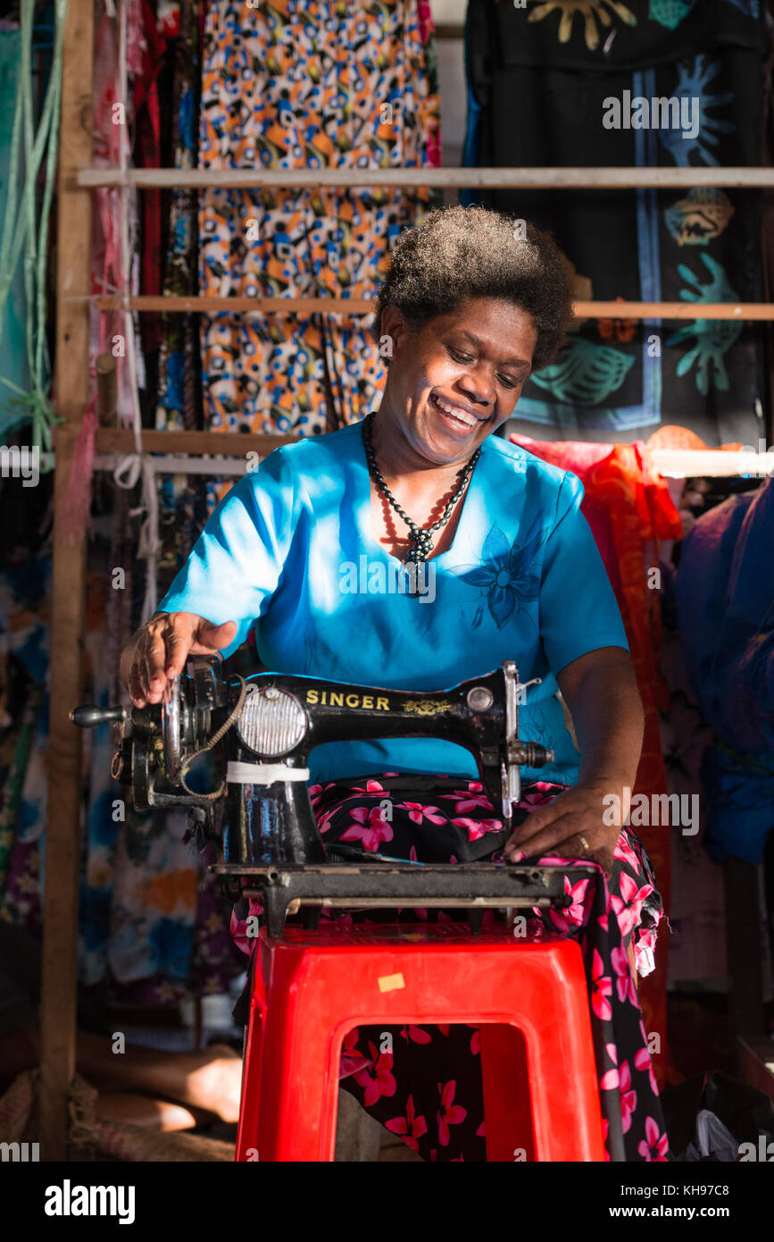 Rosa Vatu sewing at one of the stalls within Port Vila Fruit and Vegetable Market, Vanuatu. Stock Photo