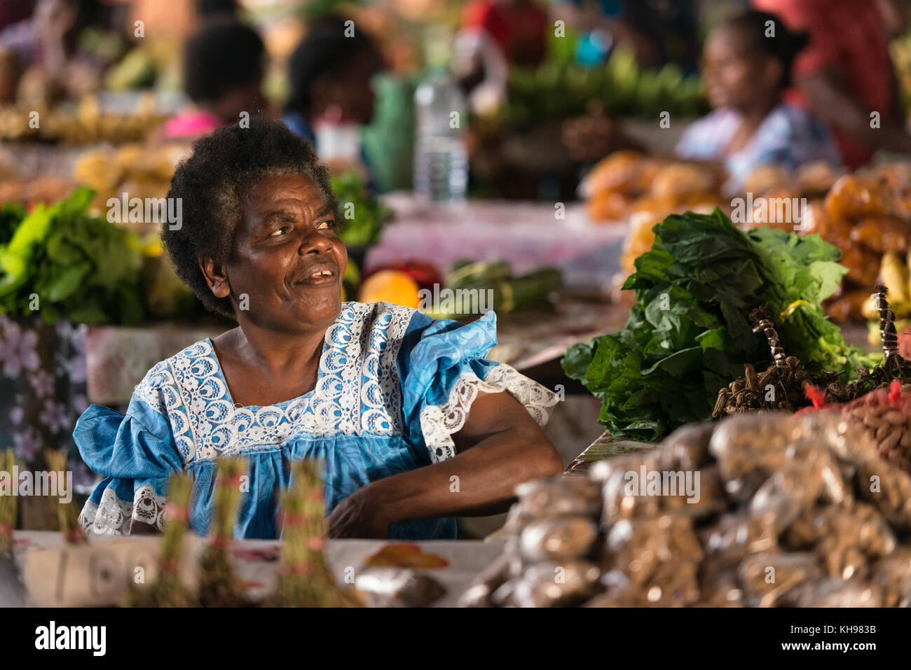 Stallholder called Name (pro Nah-may) in Port Vila Fruit and Vegetable Market, Vanuatu. Stock Photo