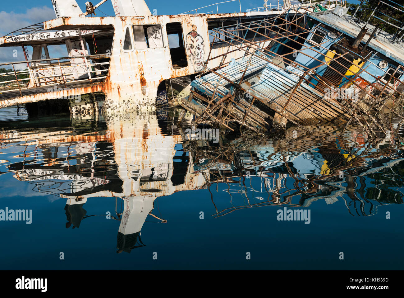Damaged, wrecked and abandoned boats in Port Vila harbour a year after Cyclone Pam. (Cyclone not necessarily responsible for all shipwrecks.)  Vanuatu Stock Photo