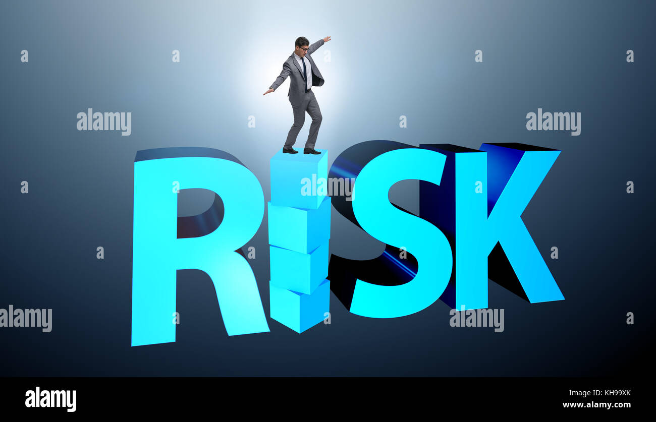 Businessman in risk and reward business concept Stock Photo - Alamy