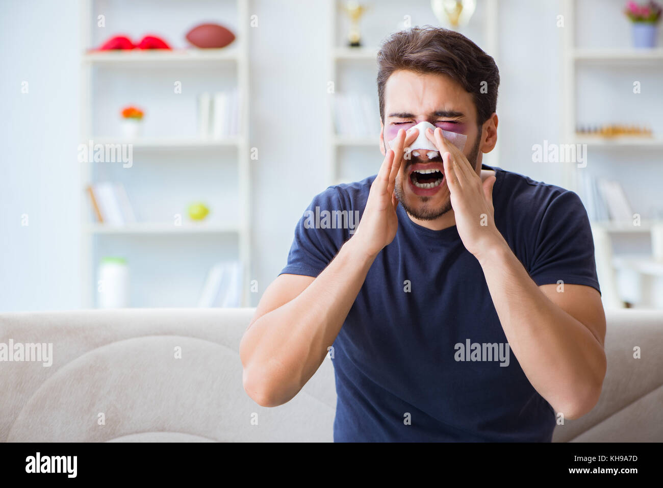 Young man recovering healing at home after plastic surgery nose job