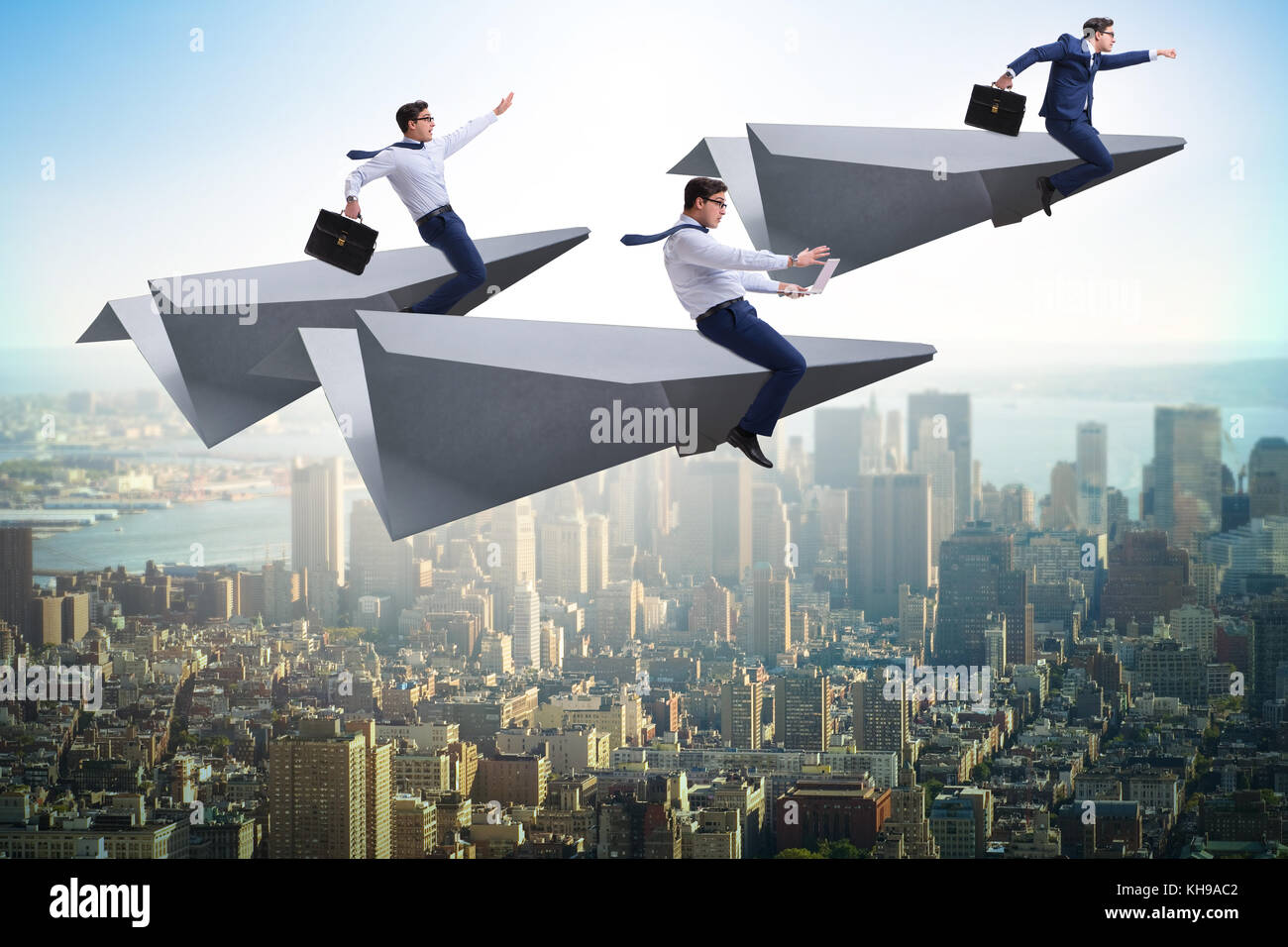Businessman flying on paper plane in business concept Stock Photo - Alamy