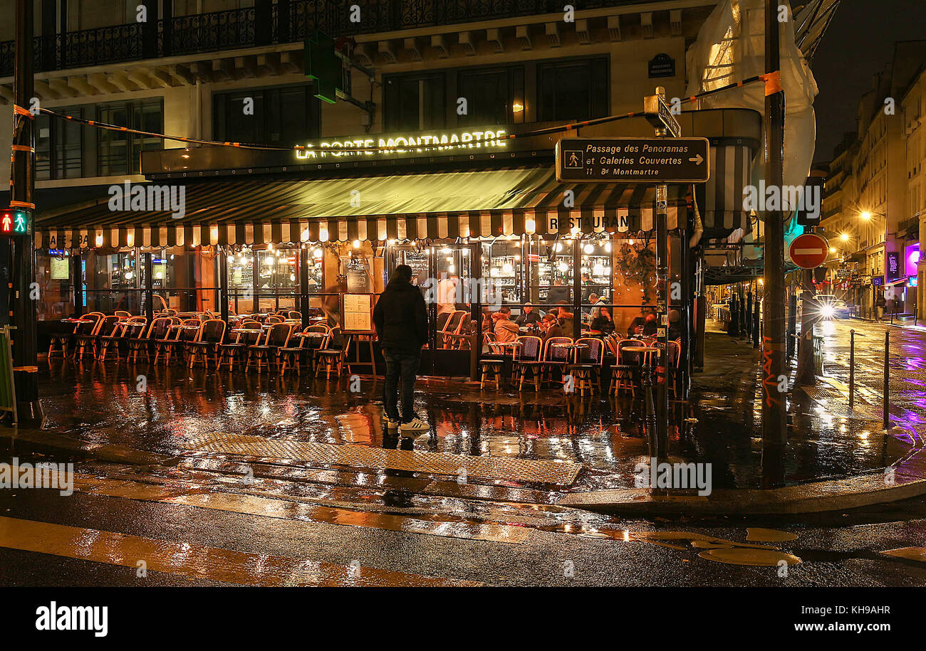 The famous cafe La porte Montmartre on Grands boulevards at rainy night ,  Paris, France Stock Photo - Alamy