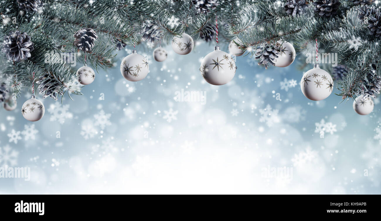 Christmas background with fir tree branches, glass balls and cones with ...