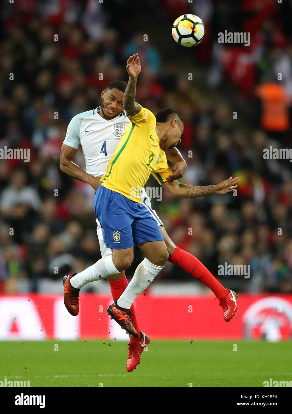 England's Joe Gomez (left) and Brazil's Gabriel Jesus battle for the ball during the Bobby Moore Fund International match at Wembley Stadium, London. Stock Photo