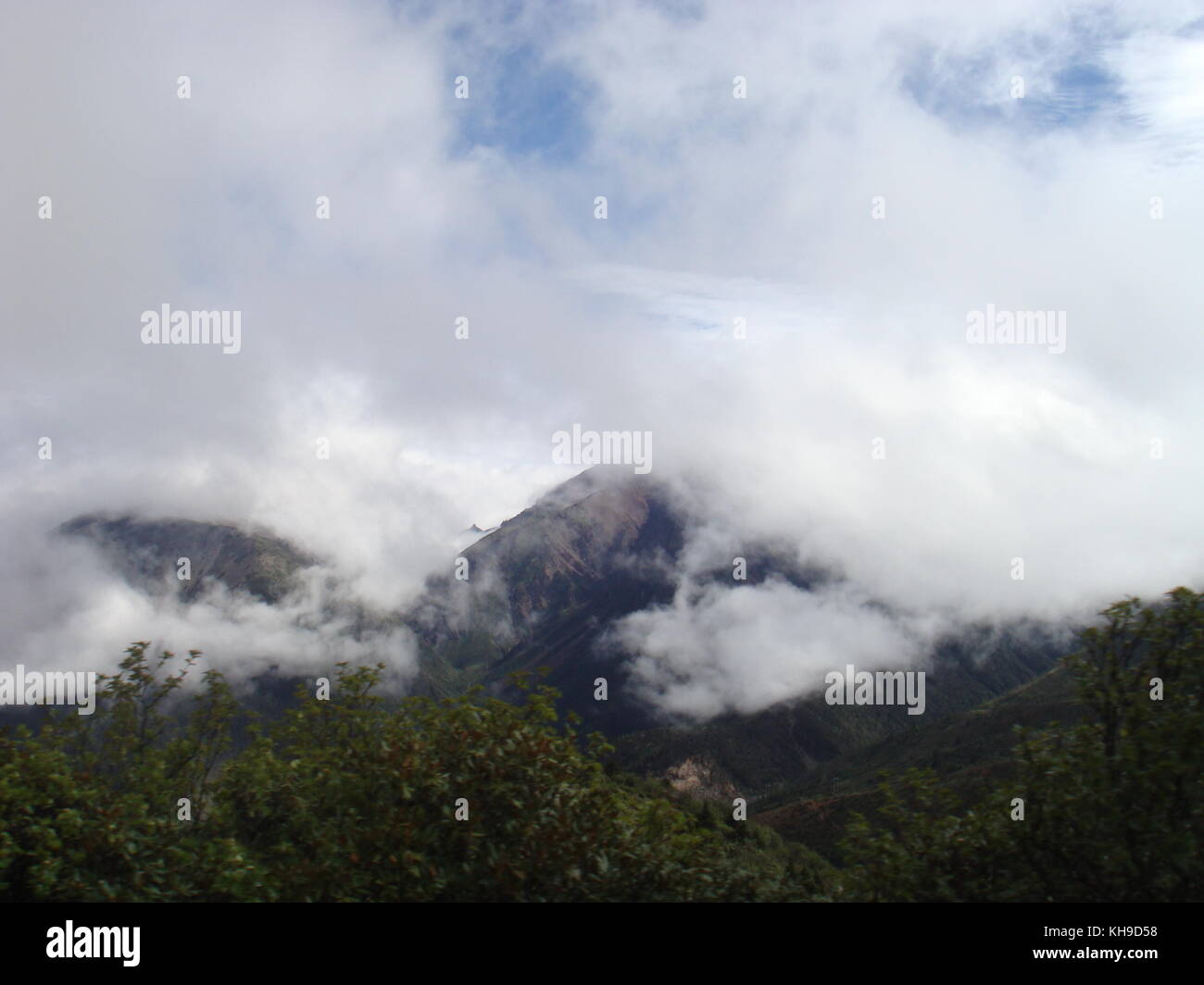 Mountain Shrouded in Clouds in Southern China Stock Photo - Alamy