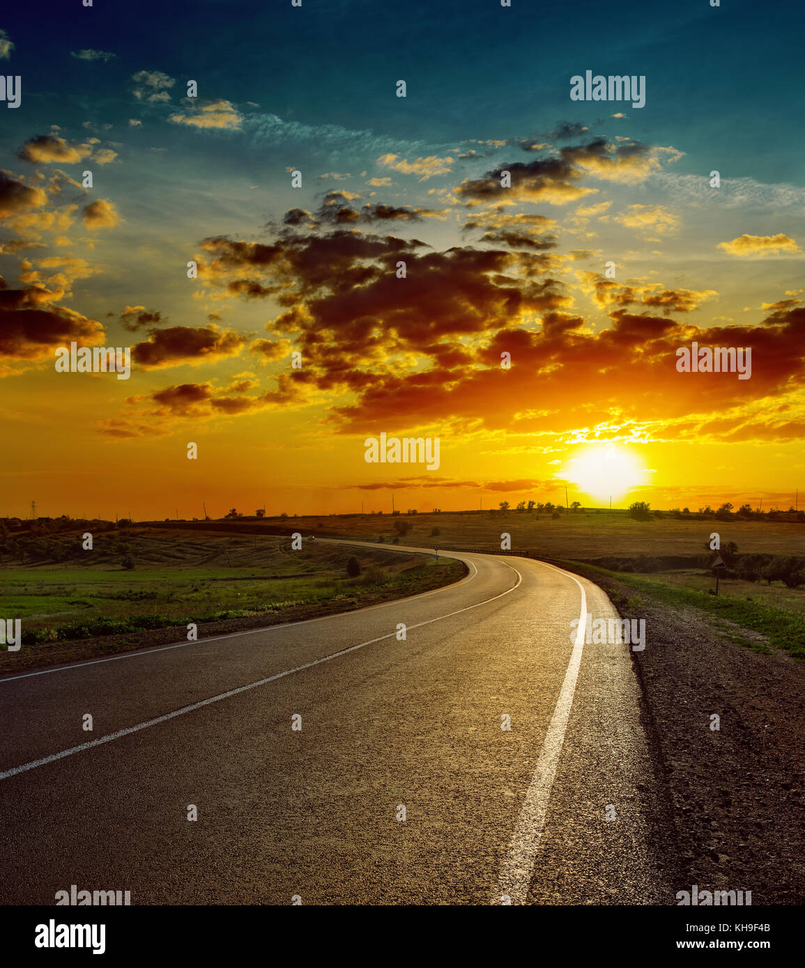 beautiful sunset over asphalt road Stock Photo - Alamy
