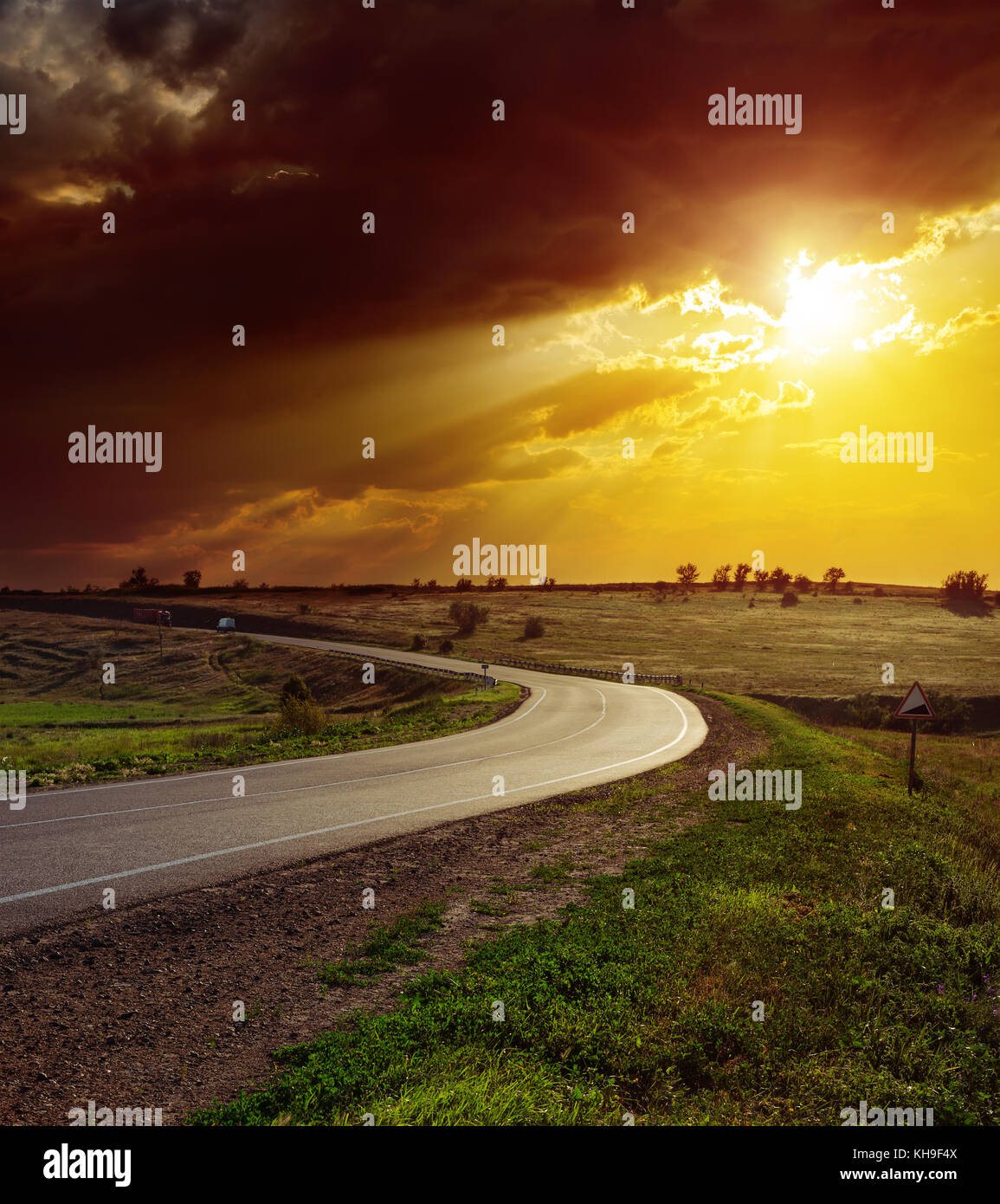 orange dramatic sunset over asphalt road Stock Photo - Alamy