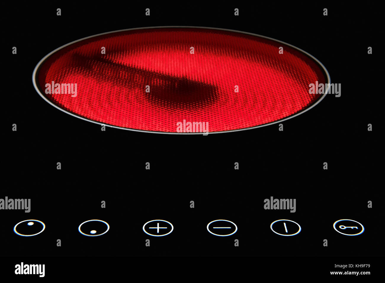 Modern induction cooker with control buttons. The electric hob closeup