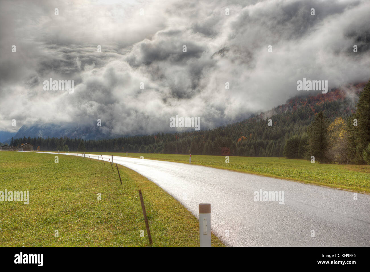 An avalanche of clouds rolling over the mountains after a rain storm ...